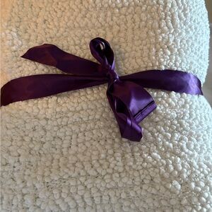 Barefoot Dreams Cream Throw with Purple Ribbon